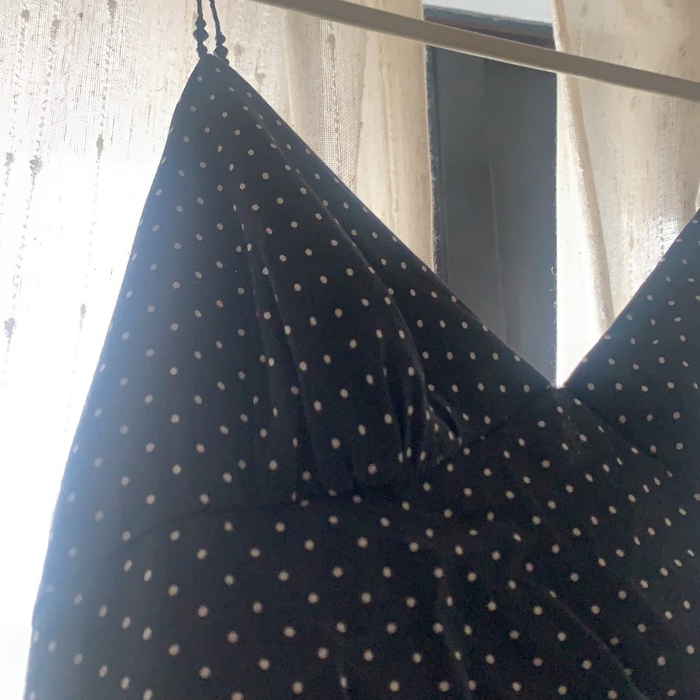 Dark blue polka dot dress with cute black beads as the straps of the dress. ;)